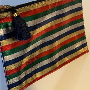Multi colored clutch with tassel zipper